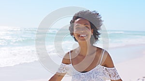 Happy smiling african american woman at beach