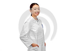 Happy smiling asian female doctor in white coat