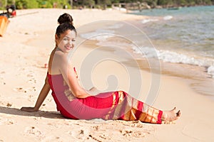 Happy Smiling Asian Girl in Traditional Dress on the Beach