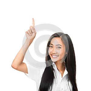 Happy smiling Asian woman pointing up and looking at camera