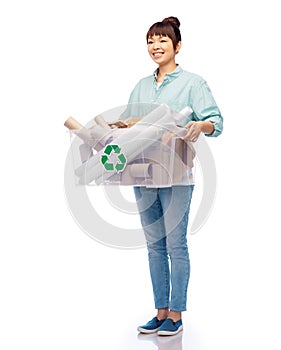 happy smiling asian woman sorting paper waste