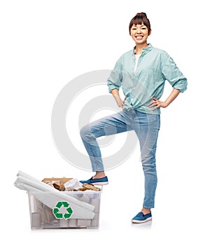 happy smiling asian woman sorting paper waste