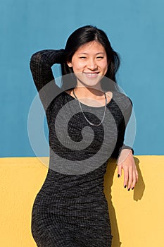 Happy smiling asian woman in a tight dress