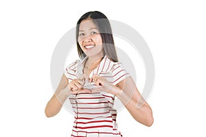 Happy smiling asian young woman making heart shape