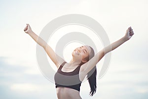 Happy smiling  woman with arms outstretched