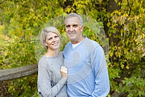 Happy and smiling attractive mature couple portrait outdoors