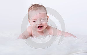 Happy smiling baby girl with blue eyes