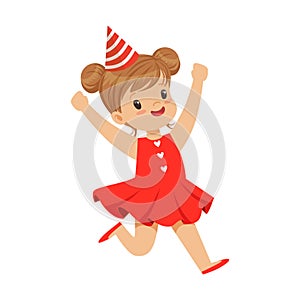 Happy smiling baby girl wearing a red dress and party hat jumping. Childrens birthday party colorful cartoon character