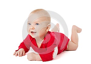 Happy Smiling Baby lying on Stomach over White Background in Cotton Bodysuit. Infant four month Child in Red long Sleeve Babies