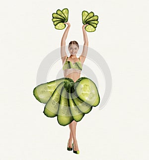 Happy, smiling, beautiful young girl with slim body in cucumber clothes over white background. Contemporary art collage.
