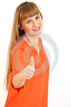 Happy smiling beautiful young woman showing thumbs up gesture, i