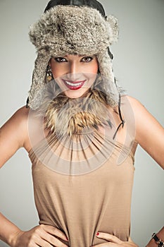 Happy smiling beauty woman wearing fur hat and collar