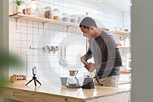 Happy Smiling Black African American male making coffee drip