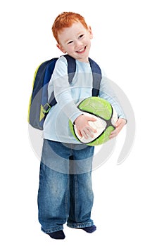 Happy smiling boy child with ball and school bag