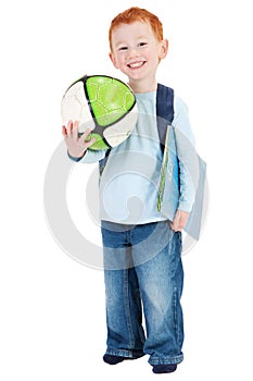 Happy smiling boy child with school bag book ball