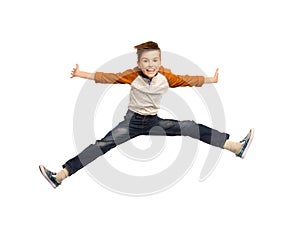 Happy smiling boy jumping in air