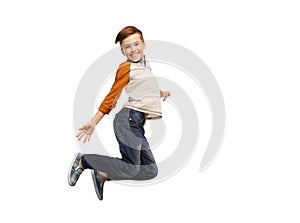 Happy smiling boy jumping in air