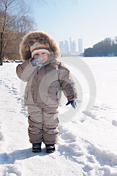 Happy smiling boy in winter clothes