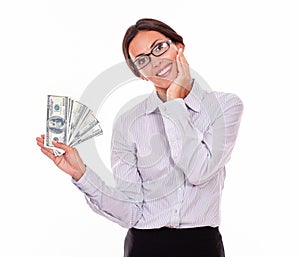 Happy smiling brunette businesswoman with money