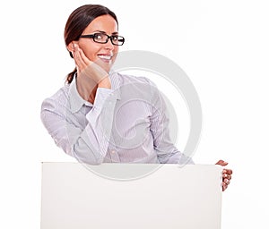 Happy smiling brunette businesswoman with placard