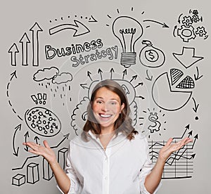 Happy smiling brunette woman with charts and light bulb above her head. Idea, brainstorming, business stratgy, thinking concept