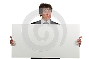 Happy smiling business man showing blank signboard, isolated over white background