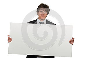 Happy smiling business man showing blank signboard, isolated over white background