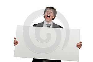 Happy smiling business man showing blank signboard, isolated over white background