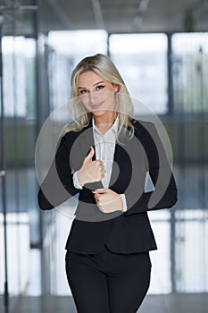 Happy smiling business woman with ok hand sign.