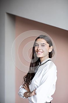 Happy smiling businesswoman. Caucasian brunette female model in business success concept studio shot