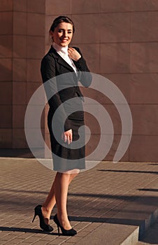 Happy smiling businesswoman standing portrait