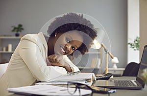 Happy smiling casual black woman office worker take rest at desk with laptop