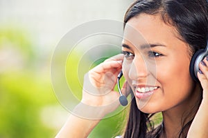 Happy smiling cheerful support phone operator wuth headset