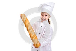 Happy smiling chef girl in a cap cook uniform, advertising the long loaf of bread. Looking at the camera. Landscape