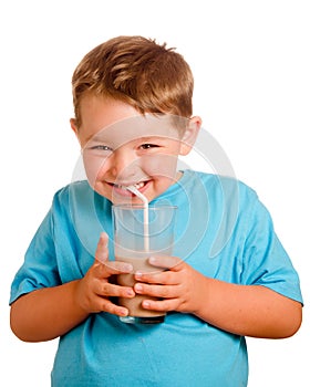 Happy smiling child drinking chocolate milk