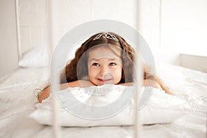 Happy smiling child waking up