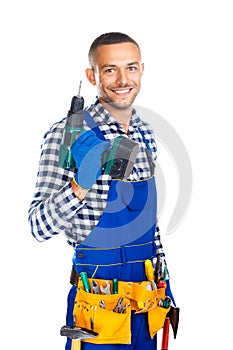 Happy smiling construction worker with drill and tool belt