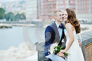 Happy smiling couple bride and groom in wedding day in Naples, Italy