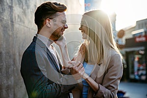 Happy smiling couple having fun together in city. People travel business happiness concept