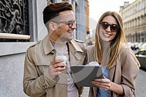 Happy smiling couple having fun together in city. People travel business happiness concept