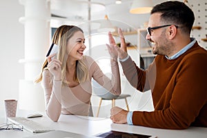 Happy smiling couple shopping online at home. Technology, e-commerce concept.