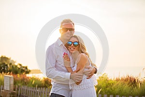 Happy smiling couple at sunset