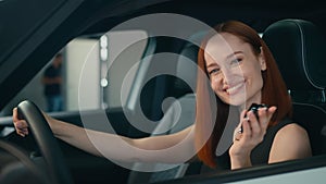 Happy smiling customer Caucasian business woman sitting inside new car smile client buyer female driver owner girl in