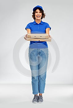 Happy smiling delivery woman with pizza boxes