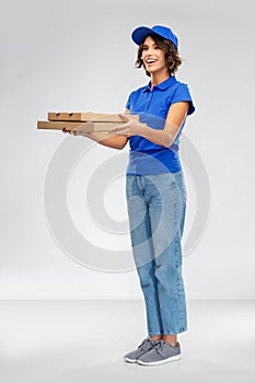 Happy smiling delivery woman with pizza boxes