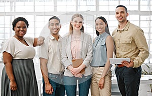 Happy, smiling and diverse team of business people standing in unity, supporting and working together in a modern office