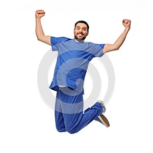happy smiling doctor or male nurse jumping in air