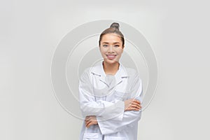 happy smiling female doctor or scientist in white coat