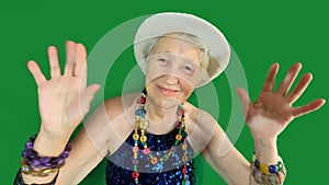 Happy smiling funny senior woman wearing beads dancing