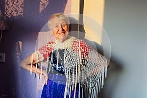 Happy smiling funny senior woman wearing beads dancing